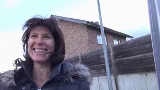 Hot German mom pleasures two massive erect penises passionately in a moving vehicle.